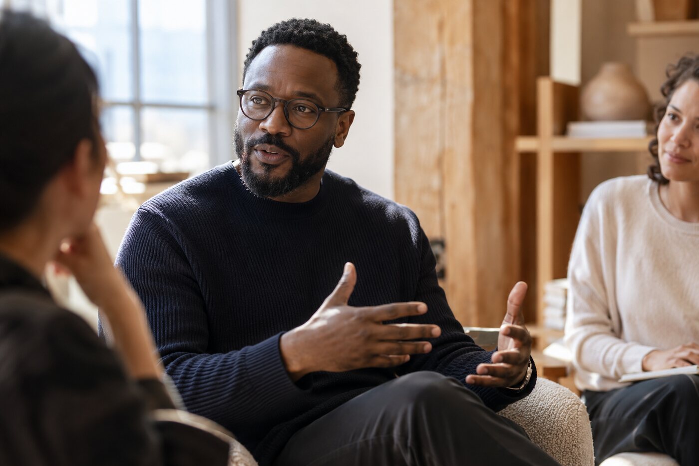 People in a thoughtful small-group conversation